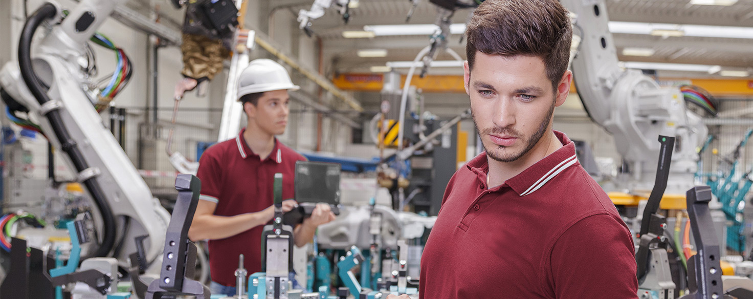 technicians working with robotics arms