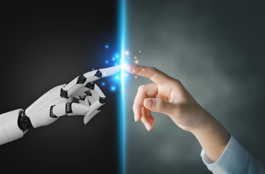 Robot and human hands pointing each other