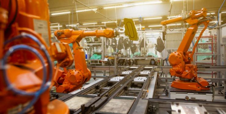 Robotics arm on factory floor