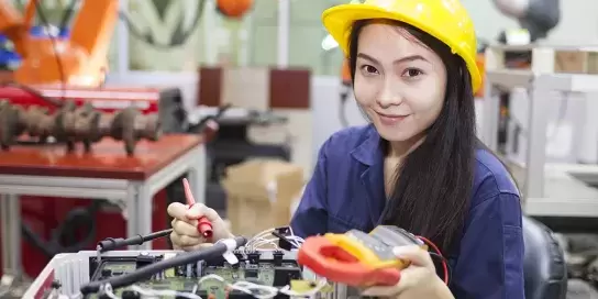 Image of student working on a robot